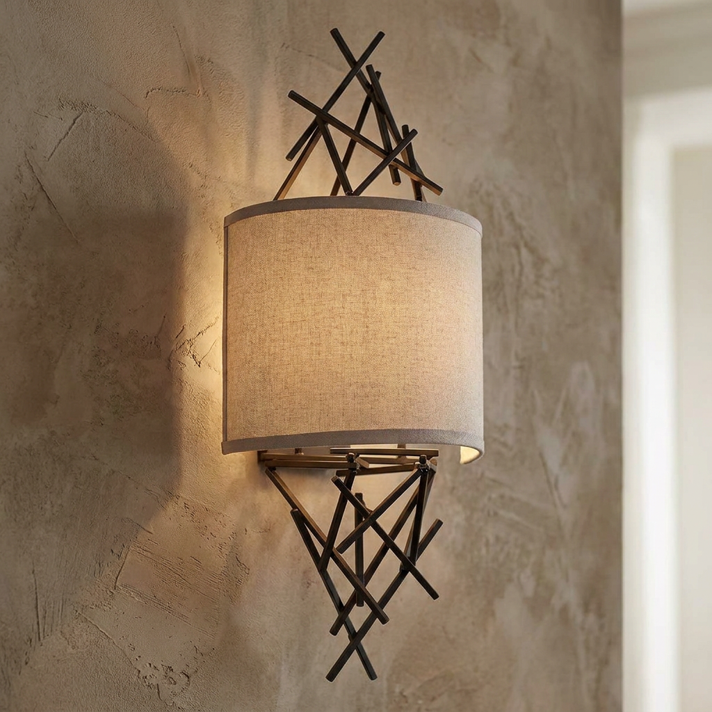 Elstead Taiko bronze wall light featuring an abstract geometric metal frame and fabric shade on a textured wall.
