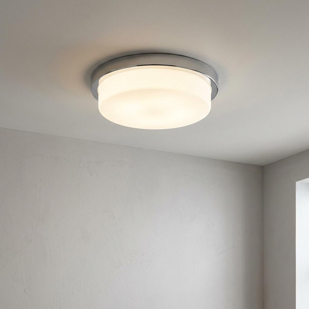 Elstead Tamar large flush bathroom light with polished chrome base and opal glass diffuser on a white ceiling.