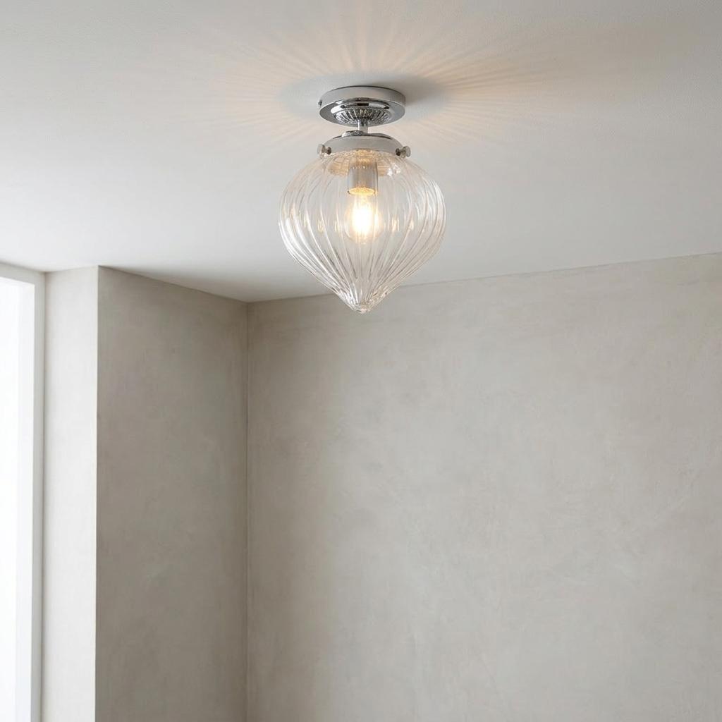 Endon Cheston 1 light flush bathroom ceiling light with a ribbed glass teardrop shade on a neutral wall background.