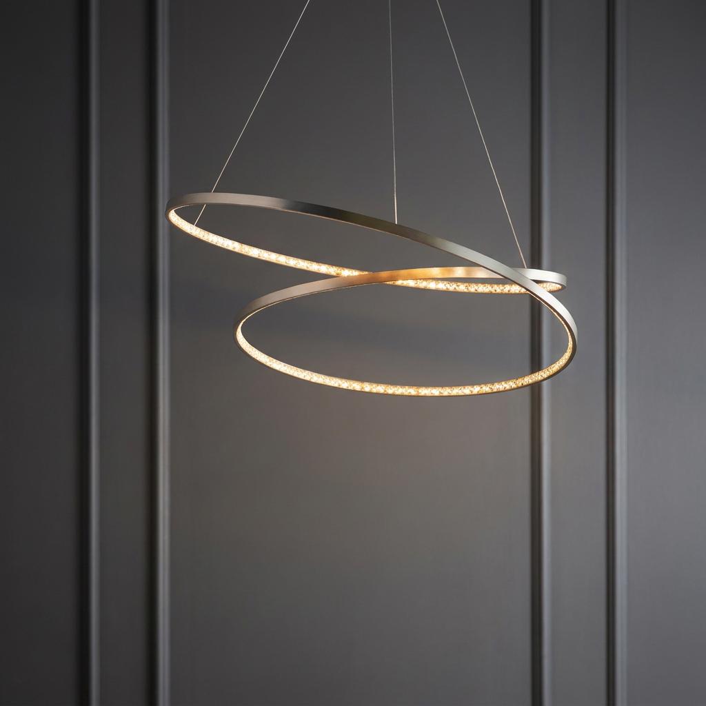 Modern interlocking double hoop LED pendant ceiling light with a satin nickel finish against a grey paneled wall.
