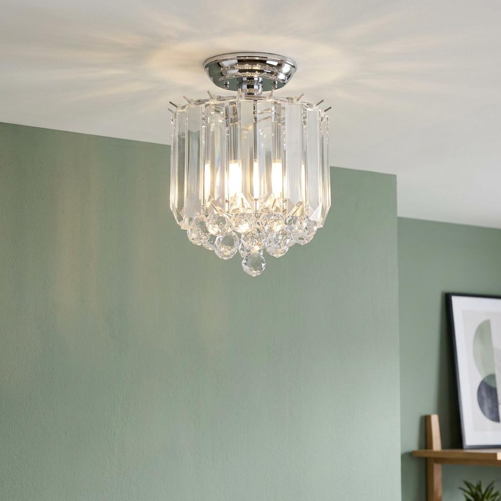 Modern 2-light flush ceiling fitting with a chrome plate and vertical clear acrylic prisms and crystal drops.