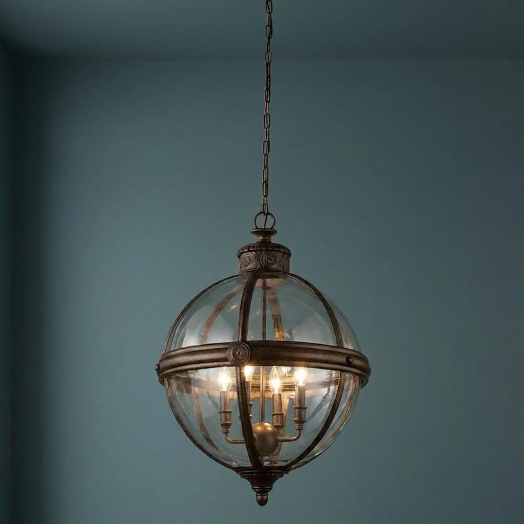 Bronze orb ceiling lantern with clear glass panels and four lights hanging against a teal background.