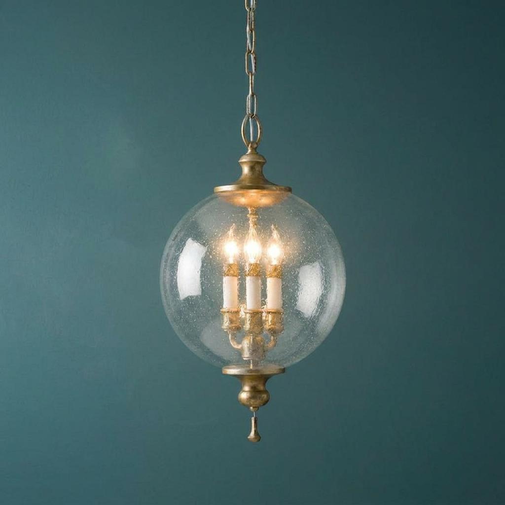 Feiss Argento ceiling lantern featuring a seeded glass globe and silver leaf finish against a dark teal wall.