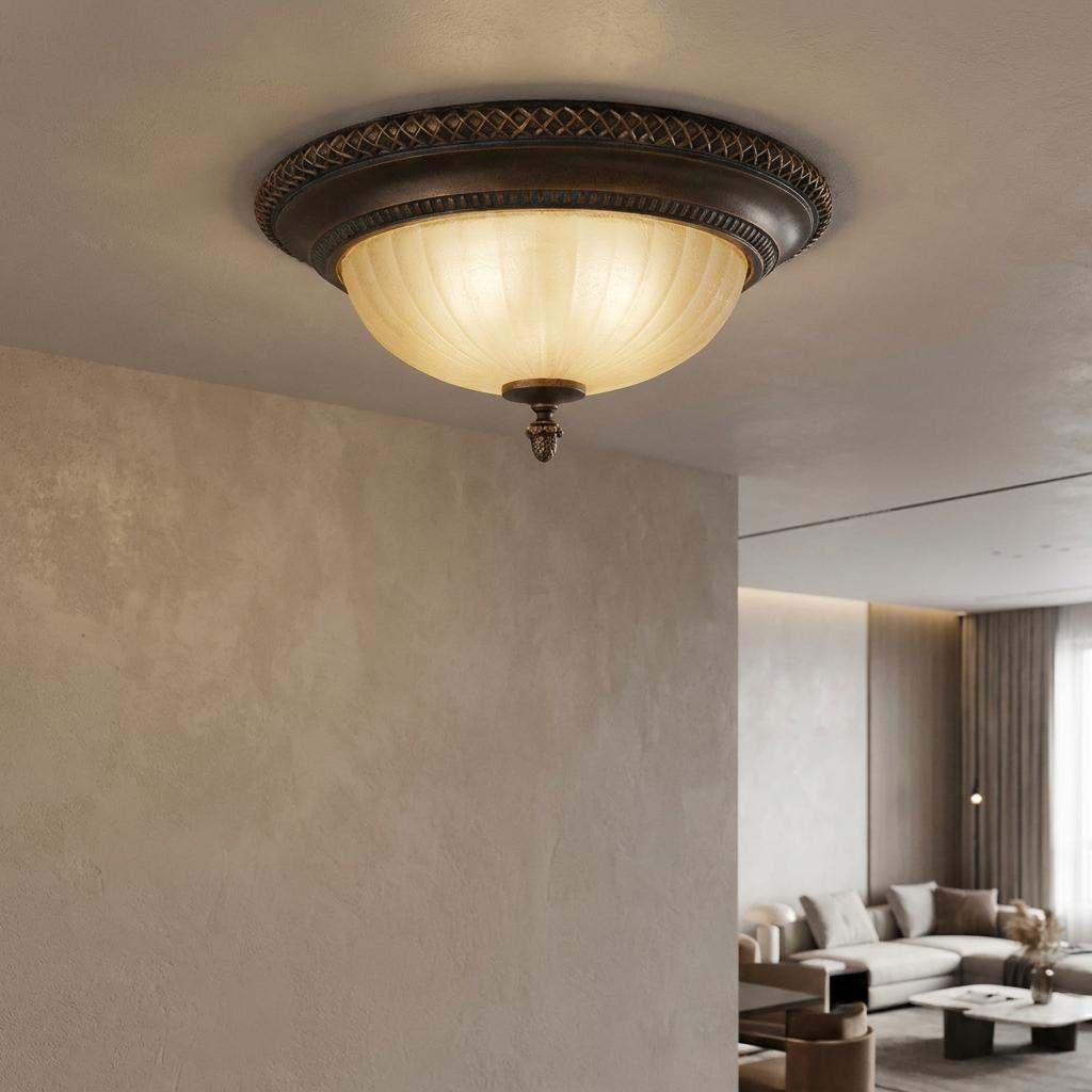 Art Deco flush ceiling light with a bronze rim and ribbed frosted glass shade glowing in a living room setting.