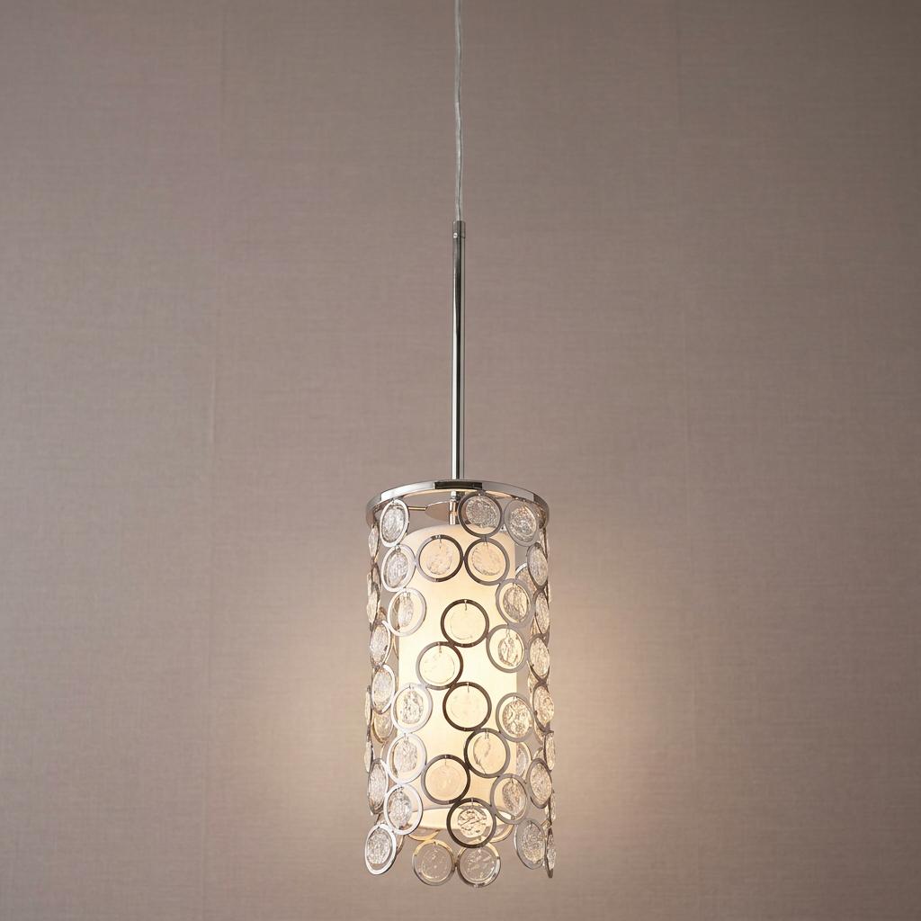 Polished nickel mini-pendant featuring a cylindrical shade with decorative glass circles and a lit inner diffuser.