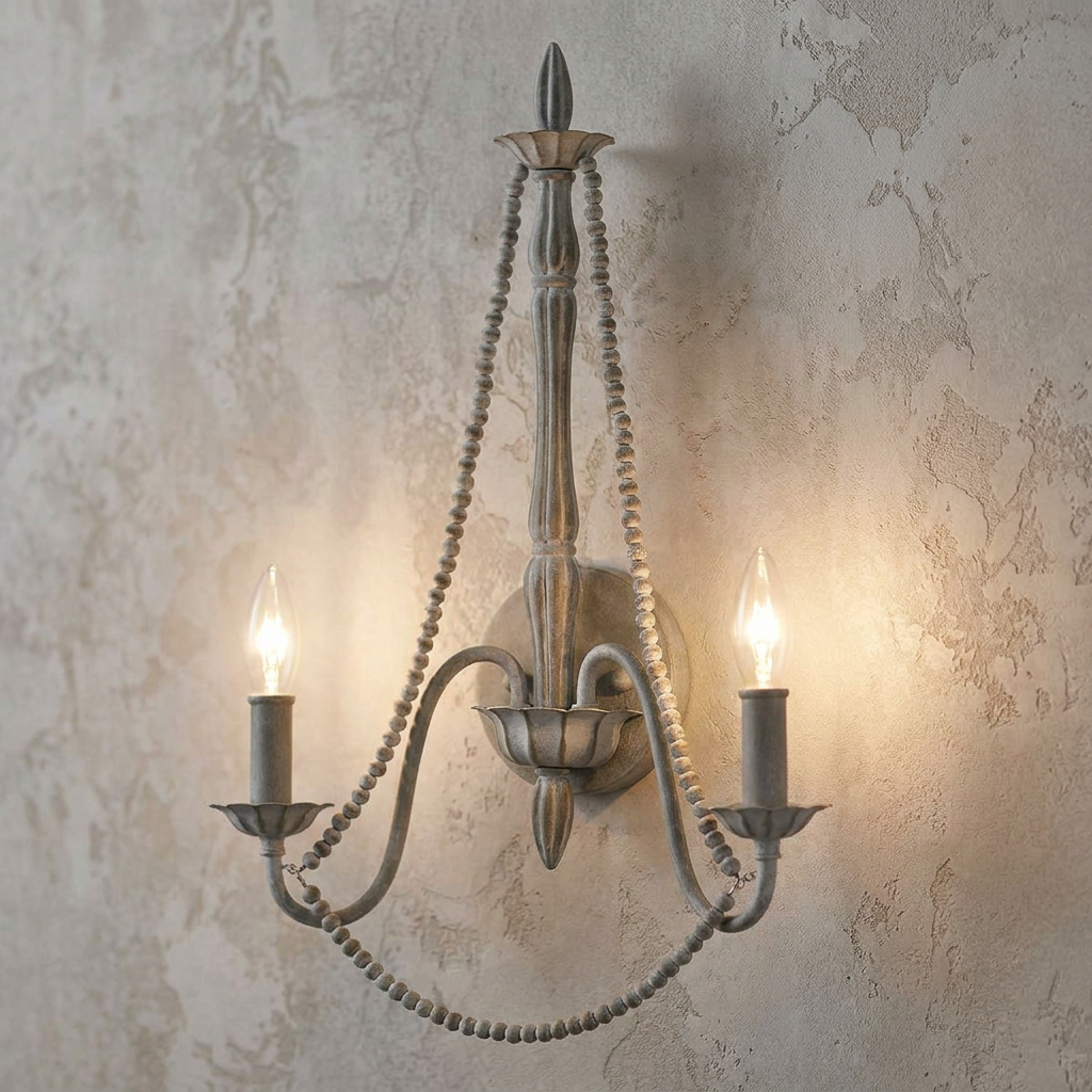 Feiss Maryville 2-light wall sconce with grey wood beads and candle-style bulbs against a textured wall.