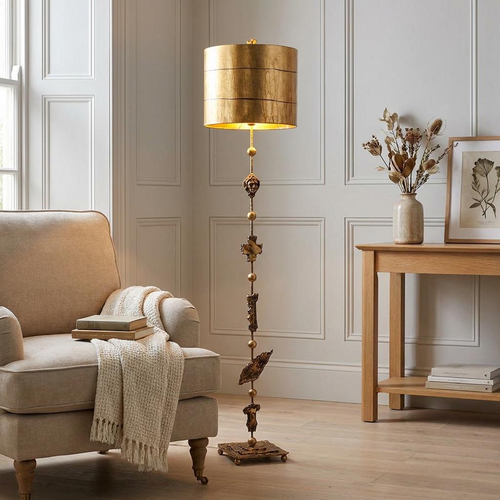 Flambeau Fragment gold floor lamp with a sculptural stem and textured shade standing in a neutral living room.