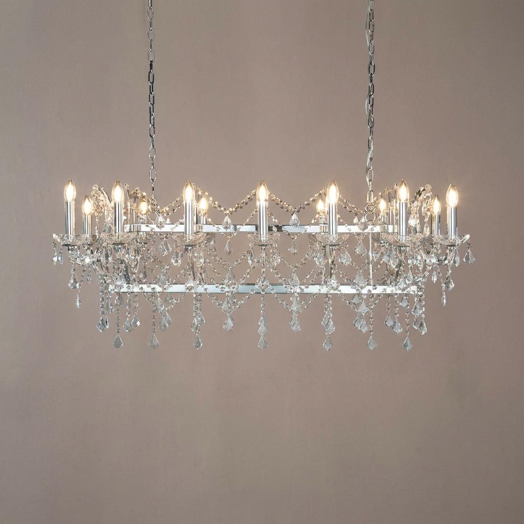 Fourteen-light chrome pendant bar with crystal drops and candle-style bulbs hanging from chains.