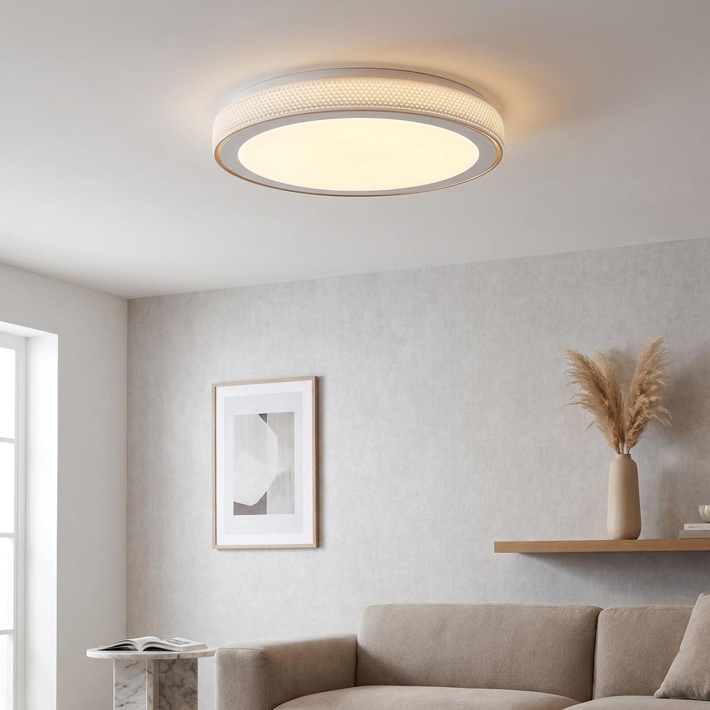 Modern flush-mount LED ceiling light with a textured white and gold frame in a neutral living room.