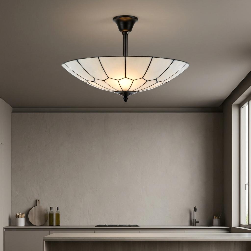 Gatsby semi-flush Tiffany ceiling light with an art deco pattern, illuminating a minimalist kitchen.