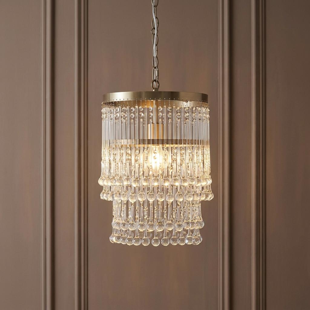 Genevieve brass and glass droplet ceiling pendant featuring tiered crystal rods against a brown paneled wall.
