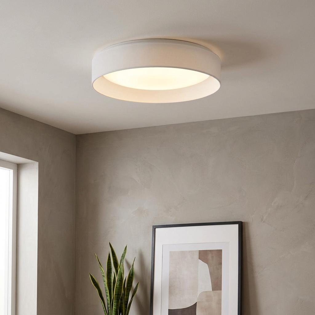 Gianna LED ceiling flush with a white acrylic shade illuminating a modern minimalist living space.