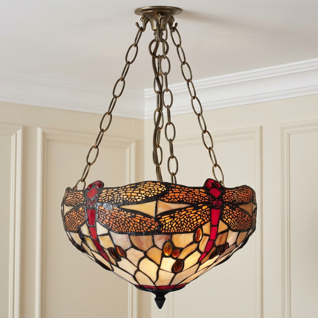 Inverted Tiffany ceiling light with a red dragonfly pattern on amber stained glass, suspended by decorative chains.