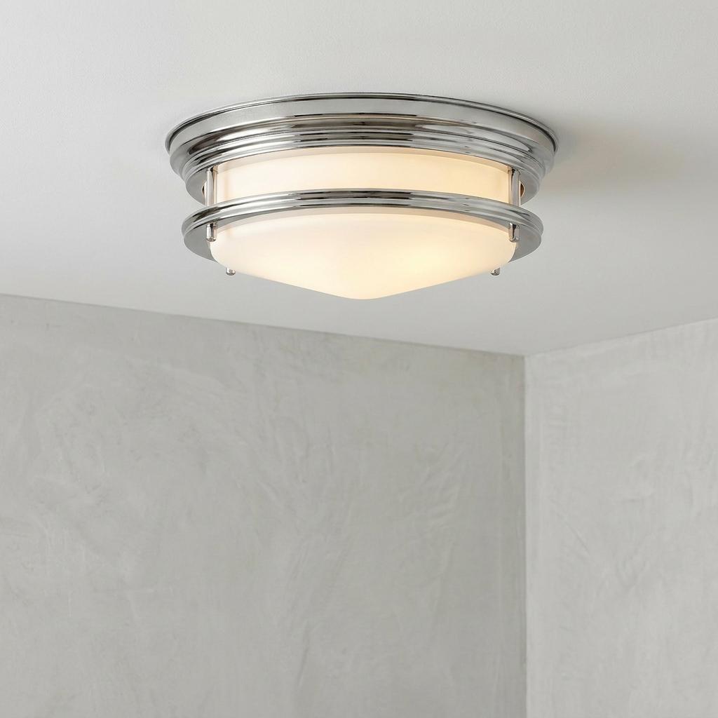 Hadrian 2-light bathroom flush ceiling light with opal glass and polished chrome trim on a white ceiling.