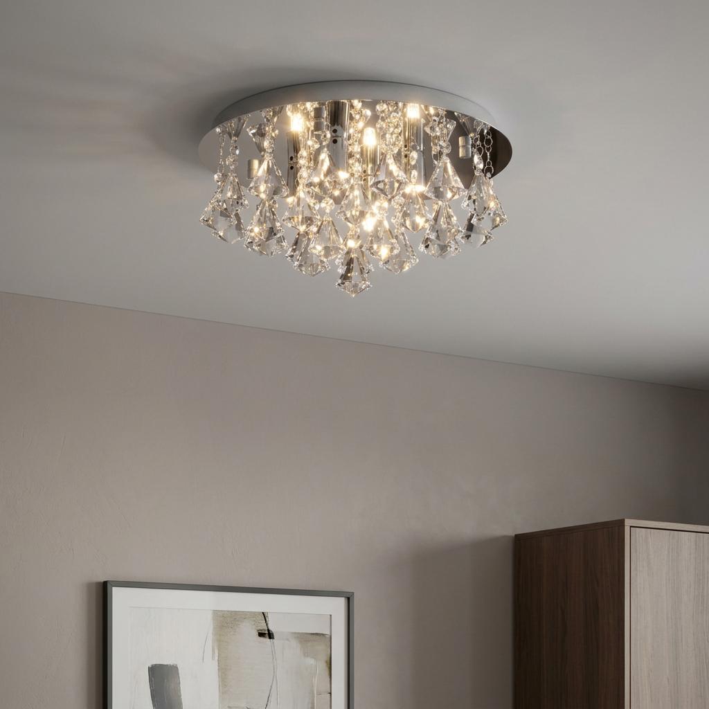 A flush-mount ceiling light with a chrome base and sparkling crystal droplets illuminated against a neutral ceiling.