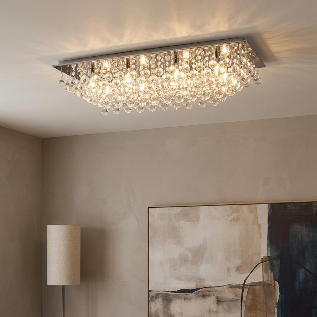 Rectangular chrome flush ceiling light with cascading crystal glass balls lit up in a modern living room.