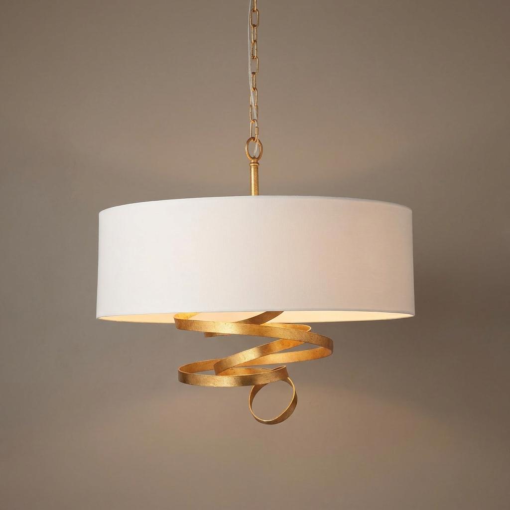 Modern three-light gold pendant fixture with a drum ivory shade and decorative gold spiral detail.