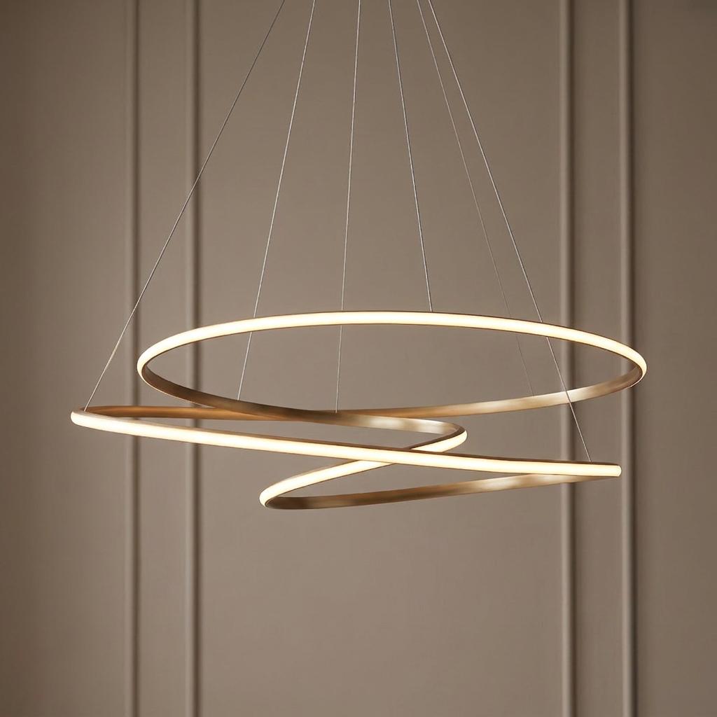 Helice Extra Large Spiral Gold Modern LED Pendant Light with glowing rings against a paneled wall.