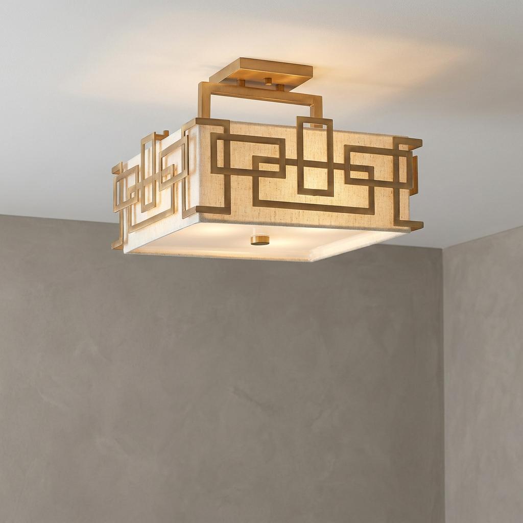 Hinkley Lanza 3 light semi flush brushed bronze ceiling light with a geometric frame and fabric shade.