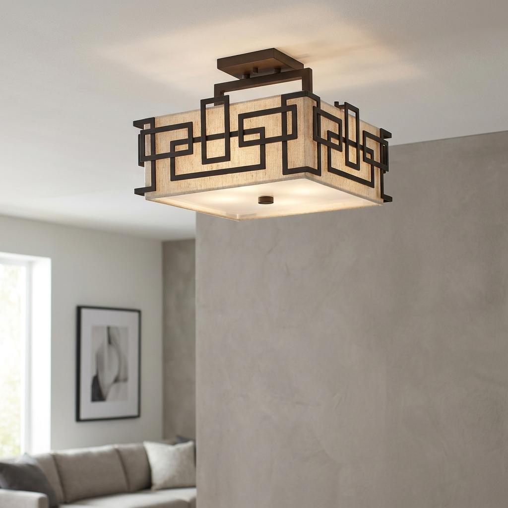 Hinkley Lanza semi-flush ceiling light with bronze geometric frame and beige fabric shade in a modern living room.