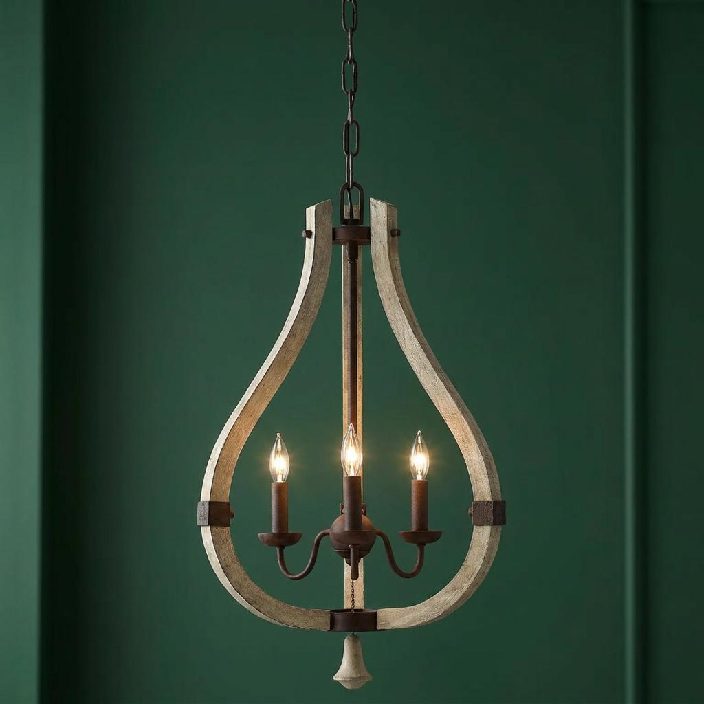 Three-light chandelier with a distressed wood teardrop frame and iron accents against a dark green wall.