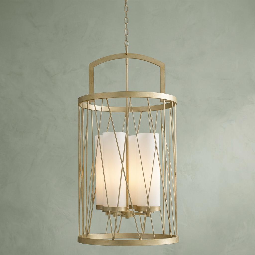 Hinkley Nest silver leaf pendant with bird-nest wire frame and four white glass shades against a green wall.