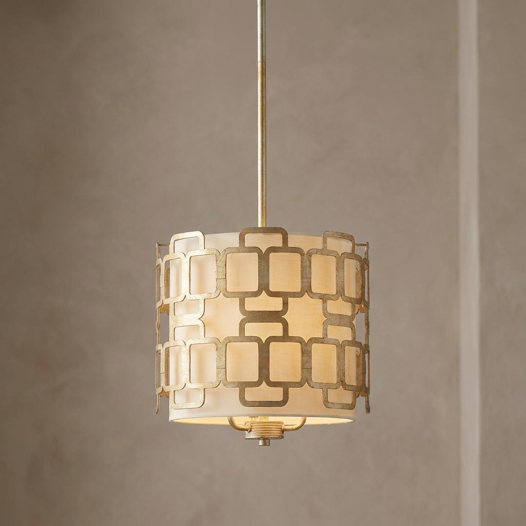 Hinkley Sabina pendant light with a geometric silver pattern over a fabric shade, hanging against a neutral wall.