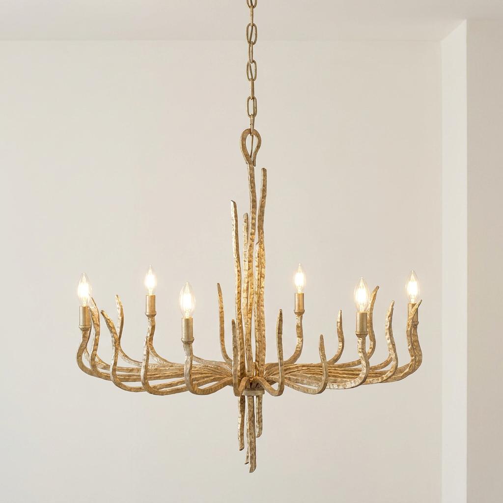 Six-light champagne gold chandelier with organic, twig-like arms and a hammered texture.