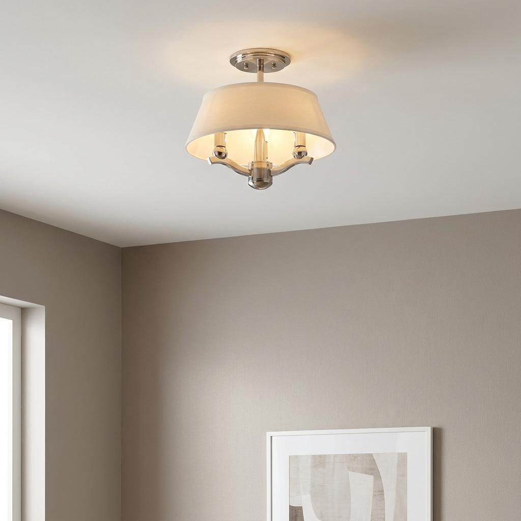 A Hinkley Whitney 3-light semi-flush mount light with a white fabric shade and polished nickel finish on a white ceiling.