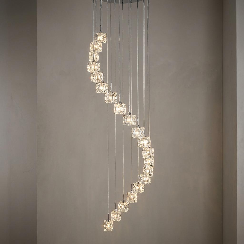 Ice Cube 20 light multi-drop pendant featuring glass cube shades in a spiral cascade against a neutral wall.