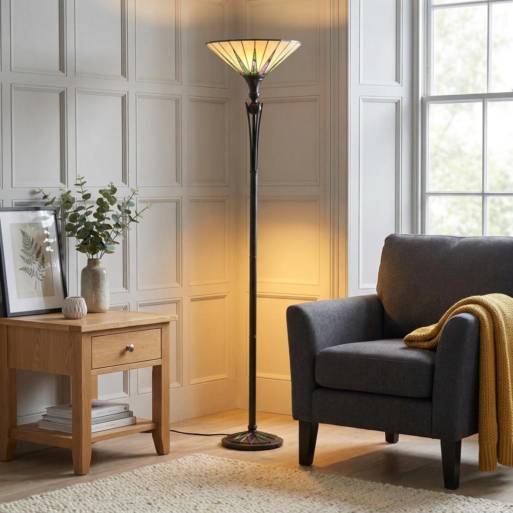 Tiffany uplighter floor lamp with geometric glass shade in a modern living room with white paneled walls.