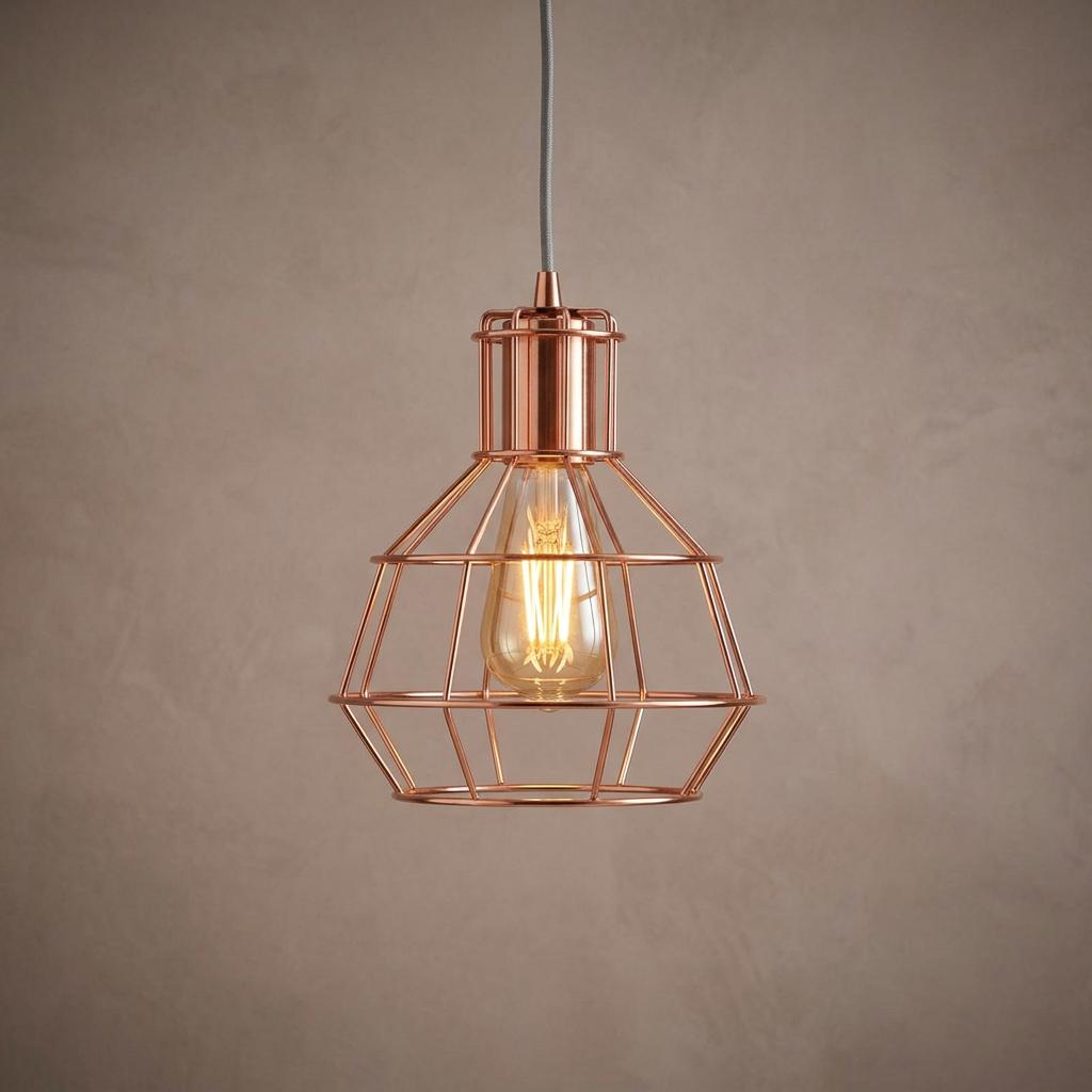 Copper caged single ceiling pendant light with a filament bulb against a grey textured background.