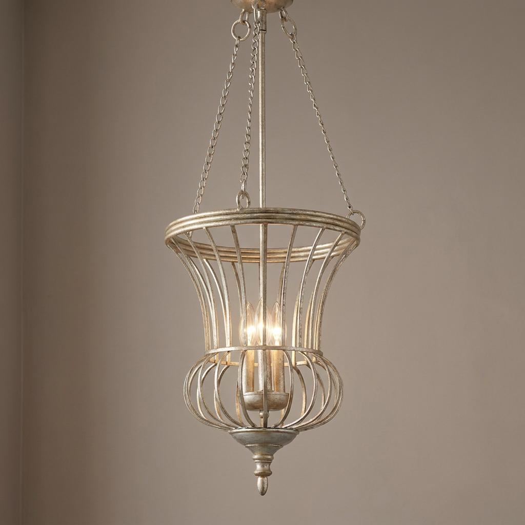 Kichler Calla 3-light pendant with an antique gold open cage design hanging against a neutral background.