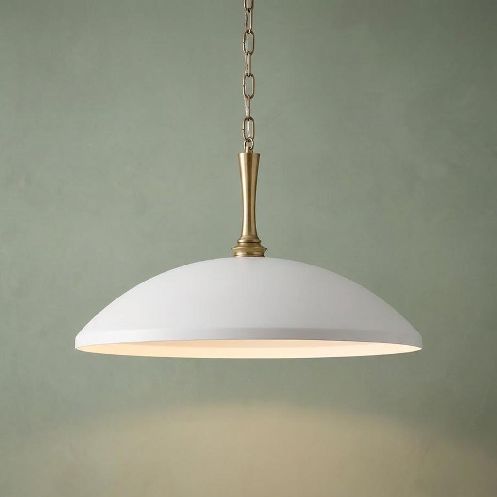 Kichler Delarosa white dome pendant light with a champagne bronze stem, hanging against a soft green background.