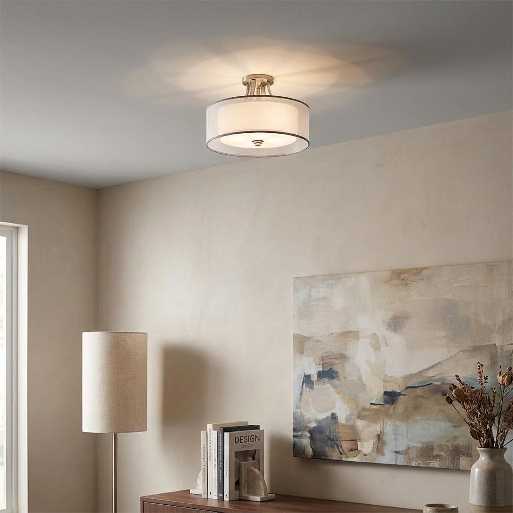 Kichler Lacey antique pewter semi-flush ceiling light with drum shade illuminating a modern living room setting.