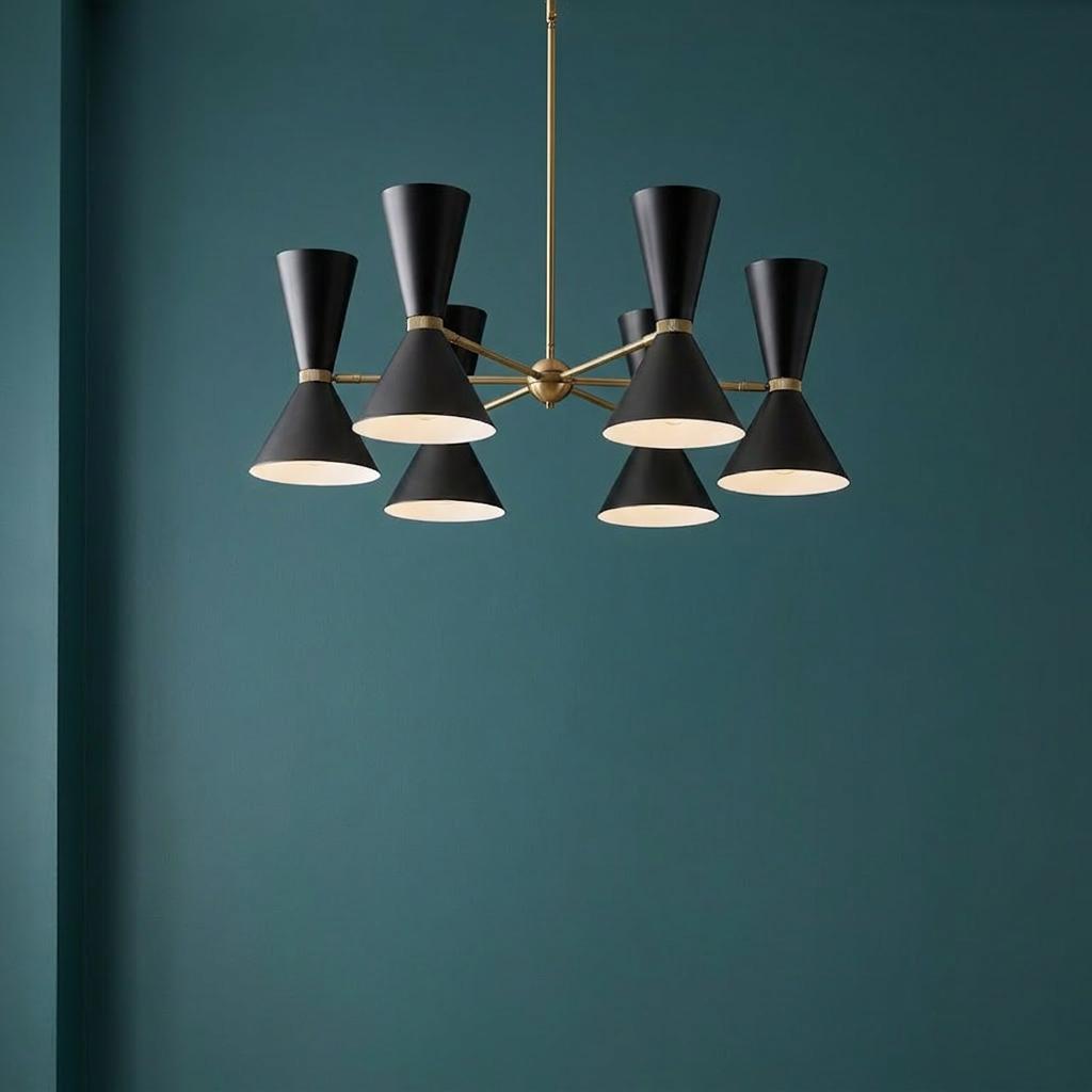 Kichler Phix 6-arm 12-light chandelier with black shades and brass hardware against a teal wall.