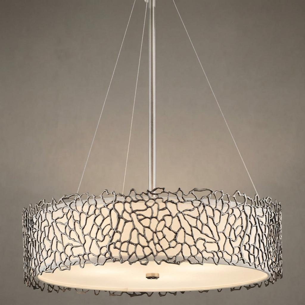 Kichler Silver Coral pendant light featuring a pewter coral-inspired overlay and frosted diffuser against a neutral wall.