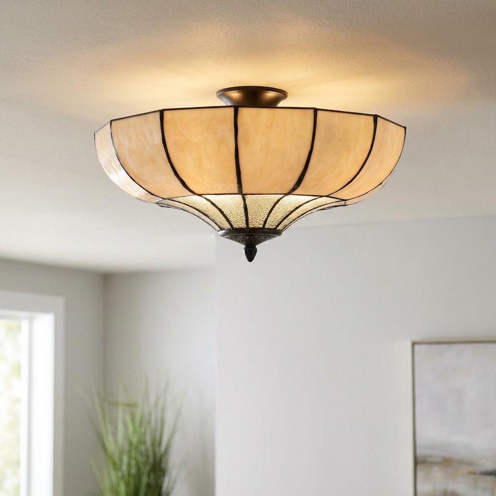 Lincoln semi-flush Tiffany ceiling light with ivory glass panels and dark bronze trim, glowing in a light room.