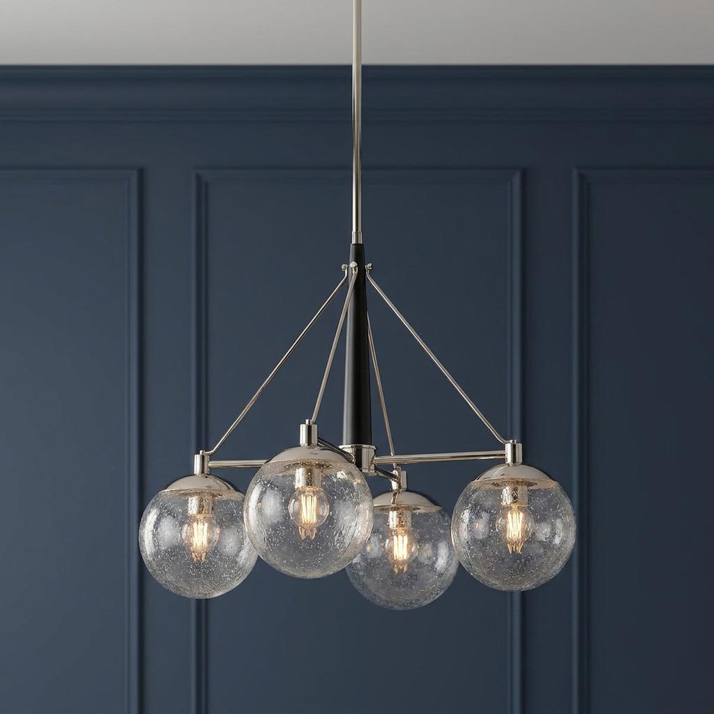Marilyn 4 Light Polished Nickel Chandelier with seeded glass globes against a dark blue paneled wall.