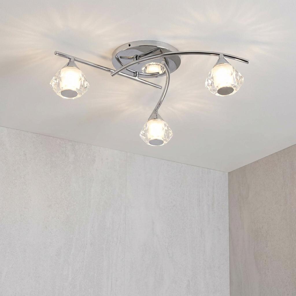 Meissa 3-light semi-flush bathroom ceiling light with chrome curved arms and decorative crystal shades on a white ceiling.