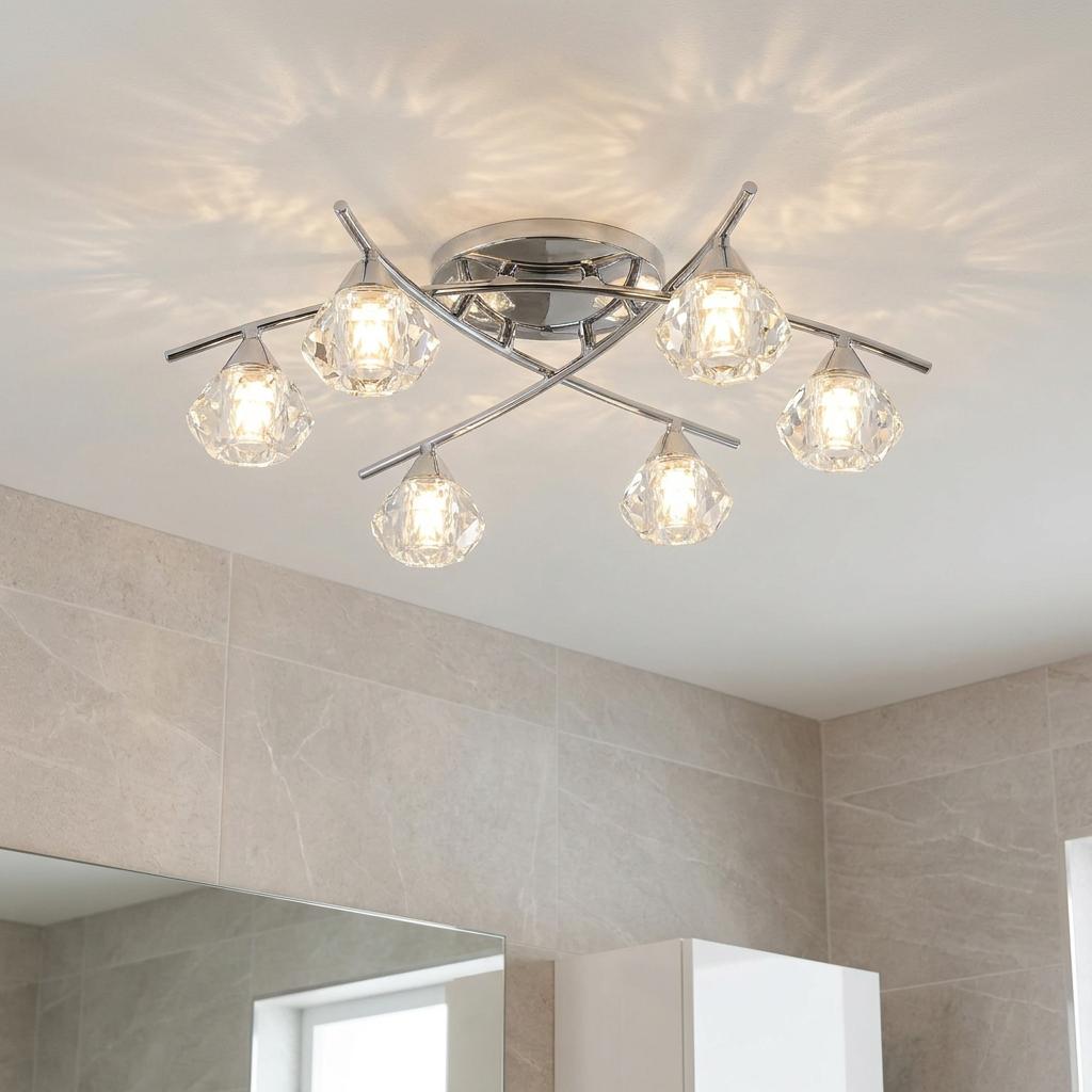 Modern 6-light chrome bathroom ceiling light with crystal glass shades casting a patterned glow on a white ceiling.