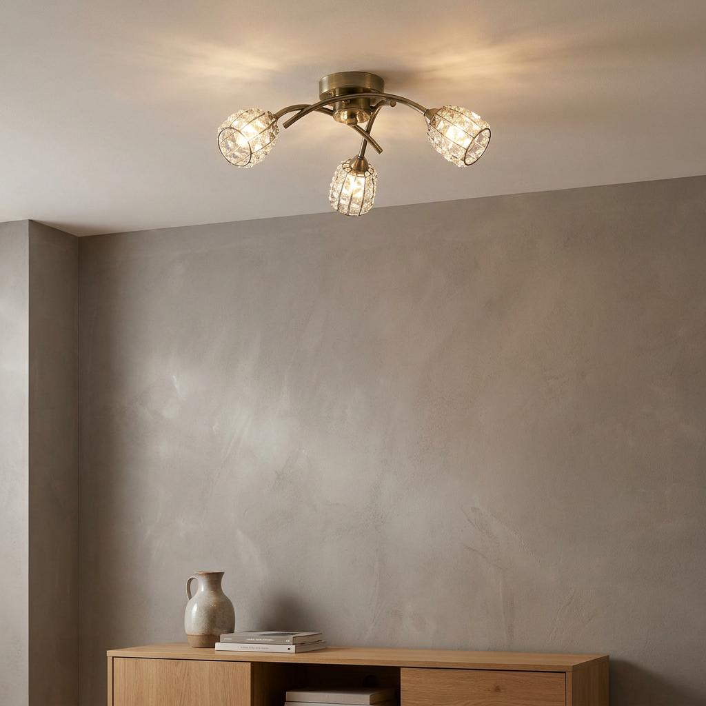 3-light antique brass flush ceiling fixture with crystal beaded shades in a contemporary living space.