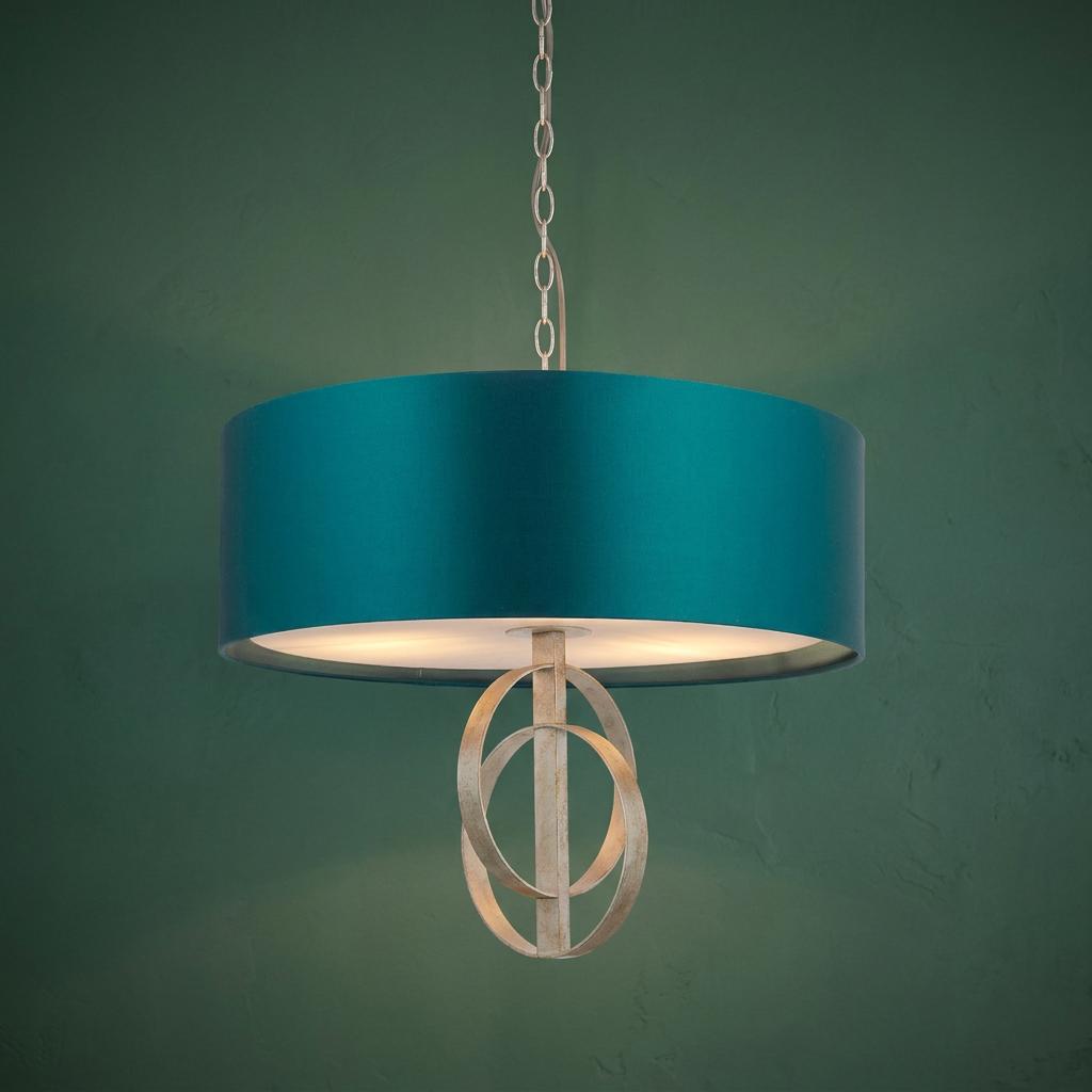 Norfolk 3-light silver leaf pendant with a large teal drum shade against a dark green textured wall.