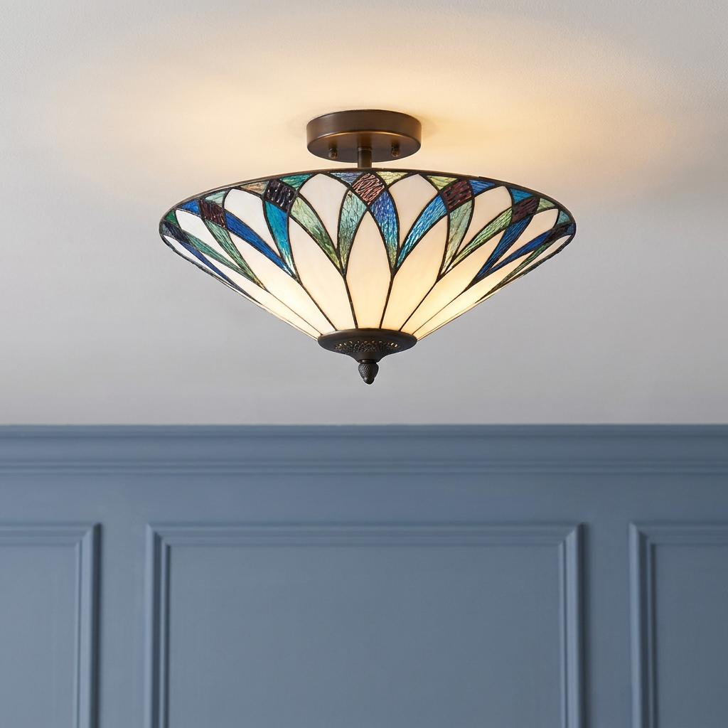 Allanton semi-flush Tiffany ceiling light with blue and green patterned glass shade mounted on a white ceiling.