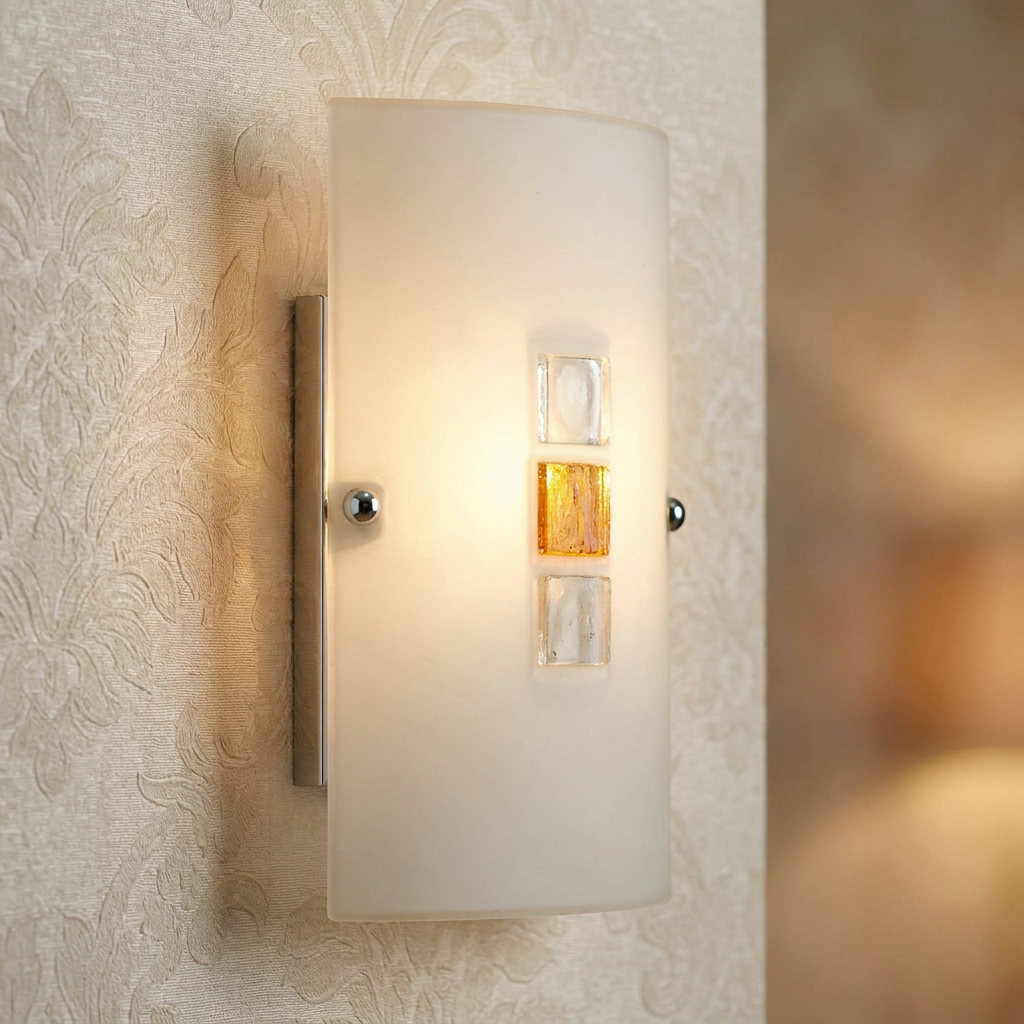 Frosted glass wall light with amber and clear glass jewel details mounted on textured cream wallpaper.