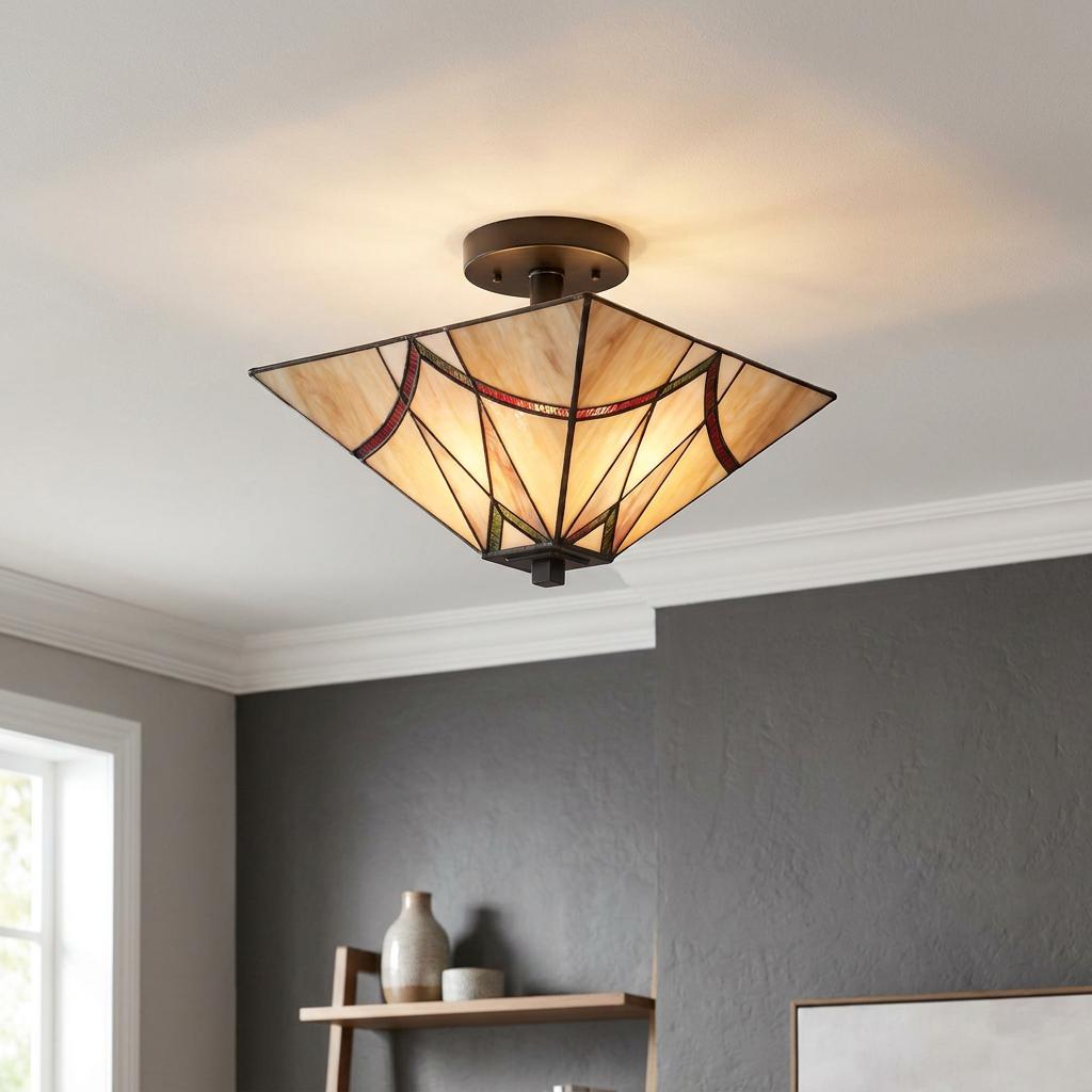 Geometric Tiffany-style semi-flush ceiling light with cream stained glass and colorful accents on a white ceiling.