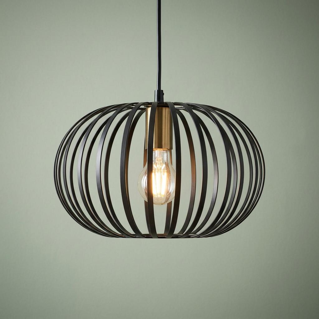 Black metal wire cage pendant light with a brass socket and a glowing light bulb.
