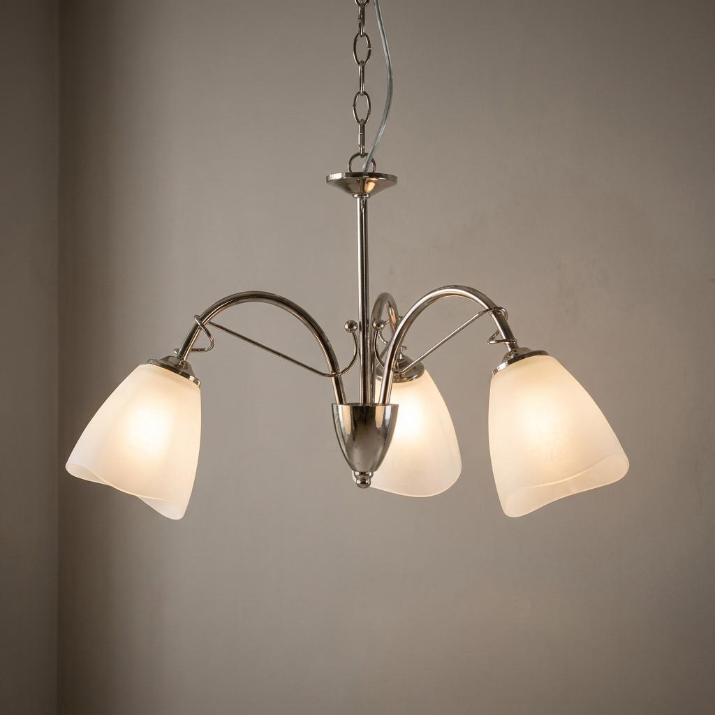 Oaks Turin 3-light chrome chandelier with curved arms and frosted glass shades in a neutral room setting.