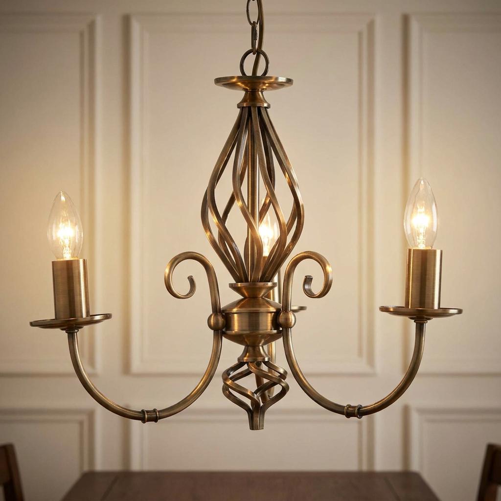 Antique brass three-light chandelier with a decorative twirled center hanging in a room with paneled walls.
