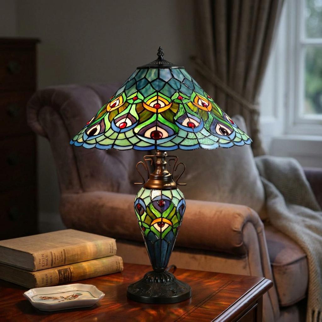 Oldbury Double Tiffany Table Lamp with a peacock feather stained glass shade on a wooden table in a living room.